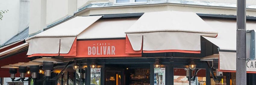 Façade vitrée et terrasse du Café Bolivar à Paris dont la décoration a été faite par le Studio Emma Roux